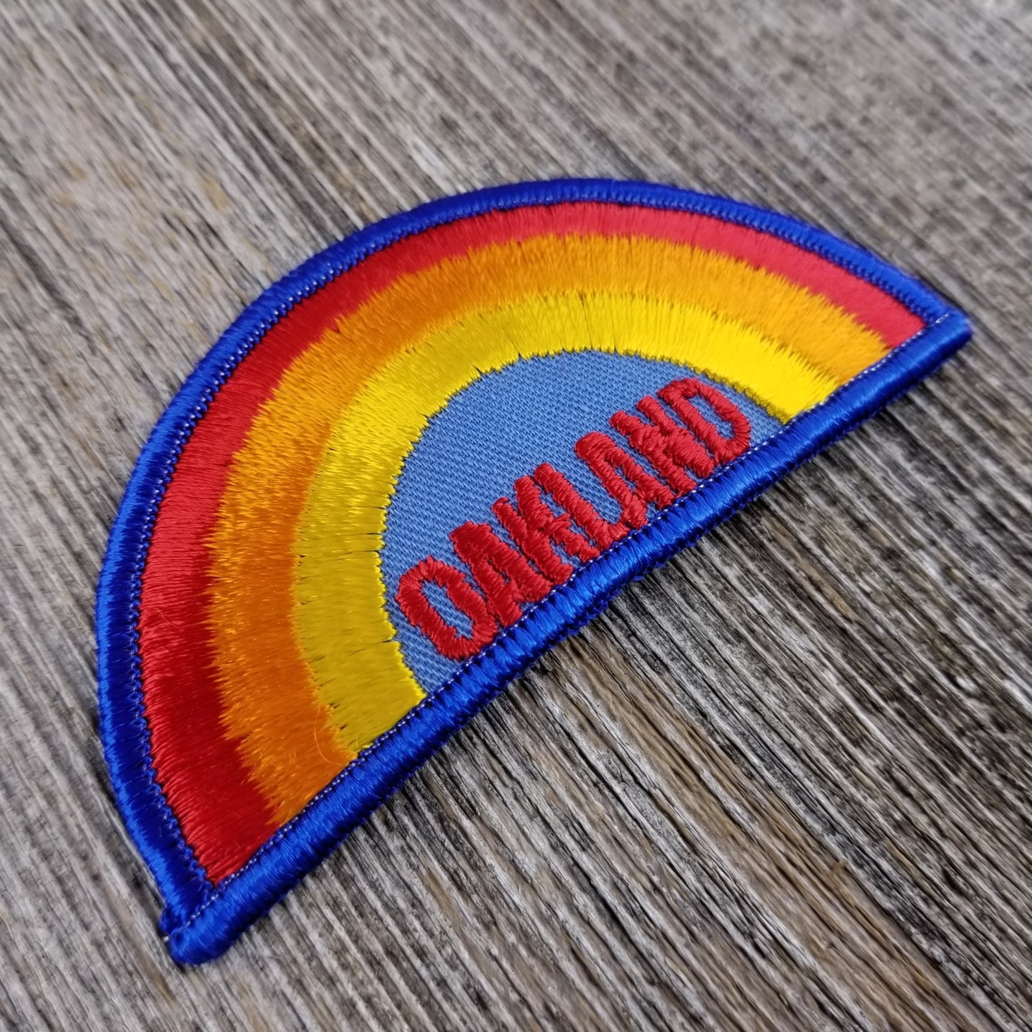 Oakland Iron On Patch - Rainbow Blue Border California